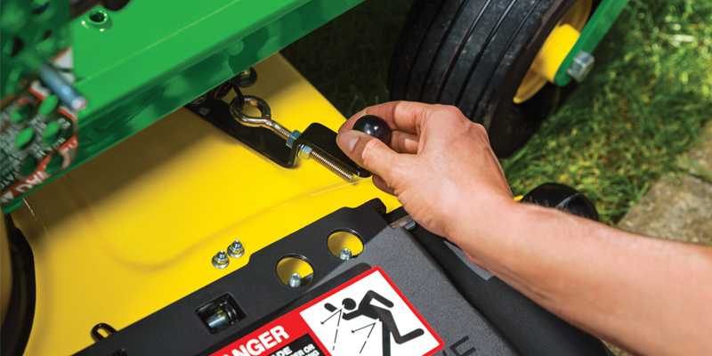 Man switching mowing modes on a John Deere zero-turn mower with a MulchControl Kit