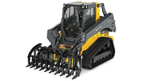 John Deere track loader with root rake attachment